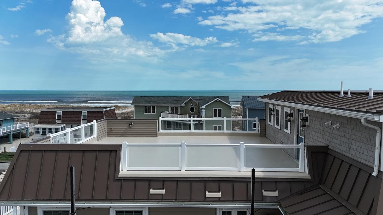 strathmere nj rooftop deck drainage restoration after — cricket scupper system full reglass