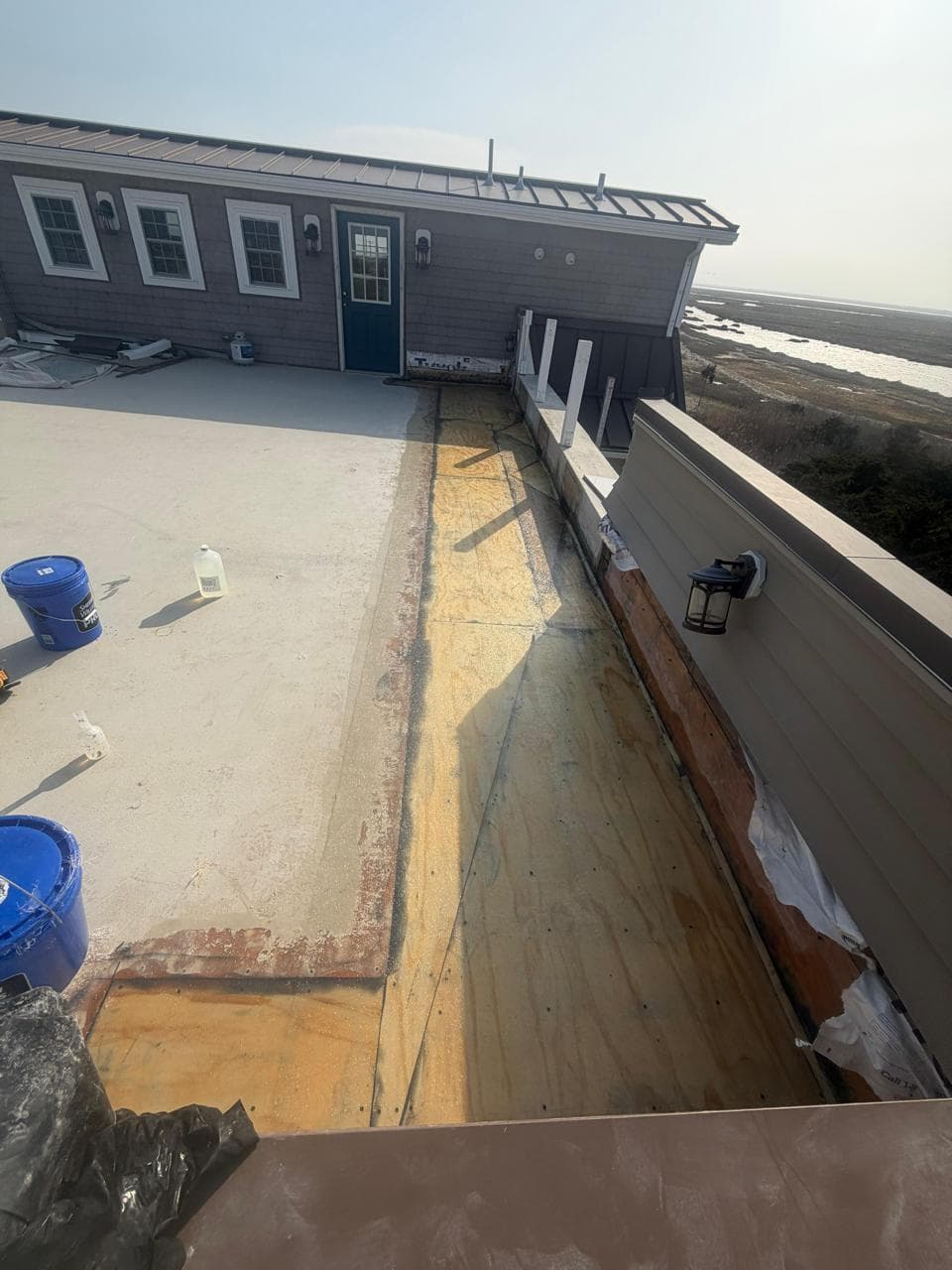 strathmere nj rooftop deck drainage restoration before — improperly flashed drains and rotted plywood